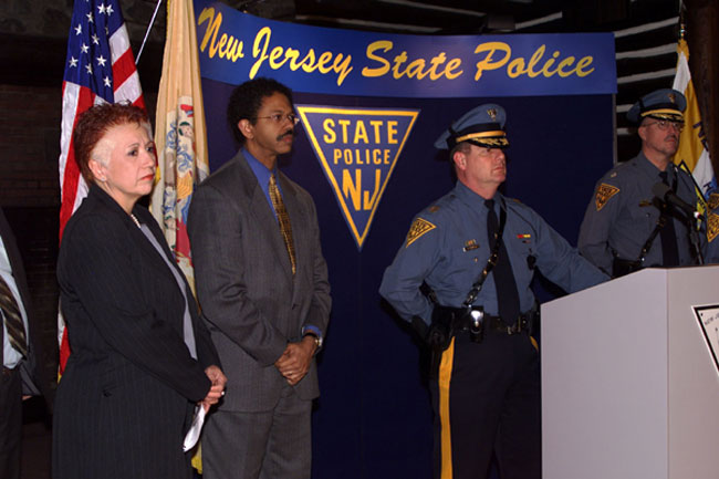 Acting State Police Superintendent Joseph "Rick" Fuentes at podium with other event speakers